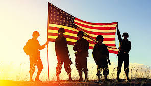 soldiers holding up american flag