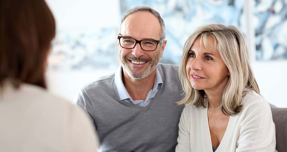 Older couple meeting with mortgage broker.