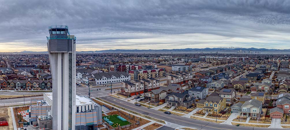 aerial view over Stapleton looking west towards downtown Denver and the Rocky Mountains.