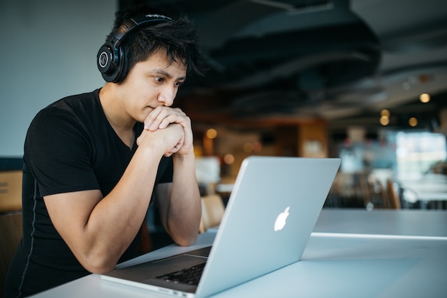 Understanding the US Debt Default - image of a person reading off a computer
