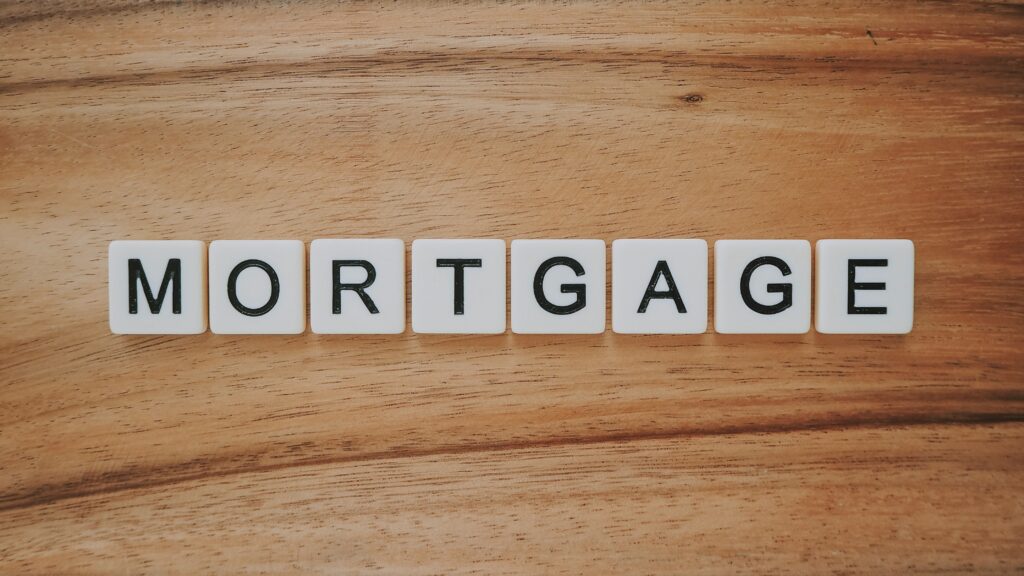 VA Loan vs Traditional Mortgage; FHA Loan mortgage in scrabble tiles