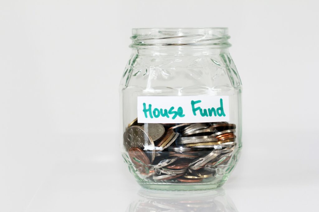 Florida Home Loans - jar with coins labeled house fund