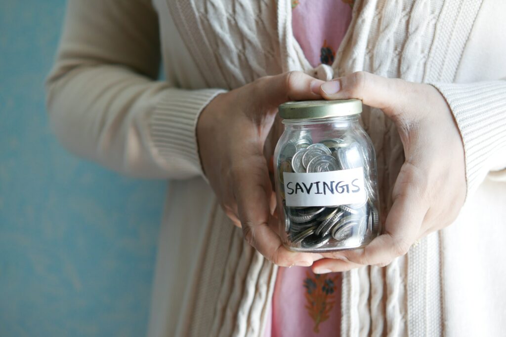 FHA Loan Colorado - woman holding Savings Jar